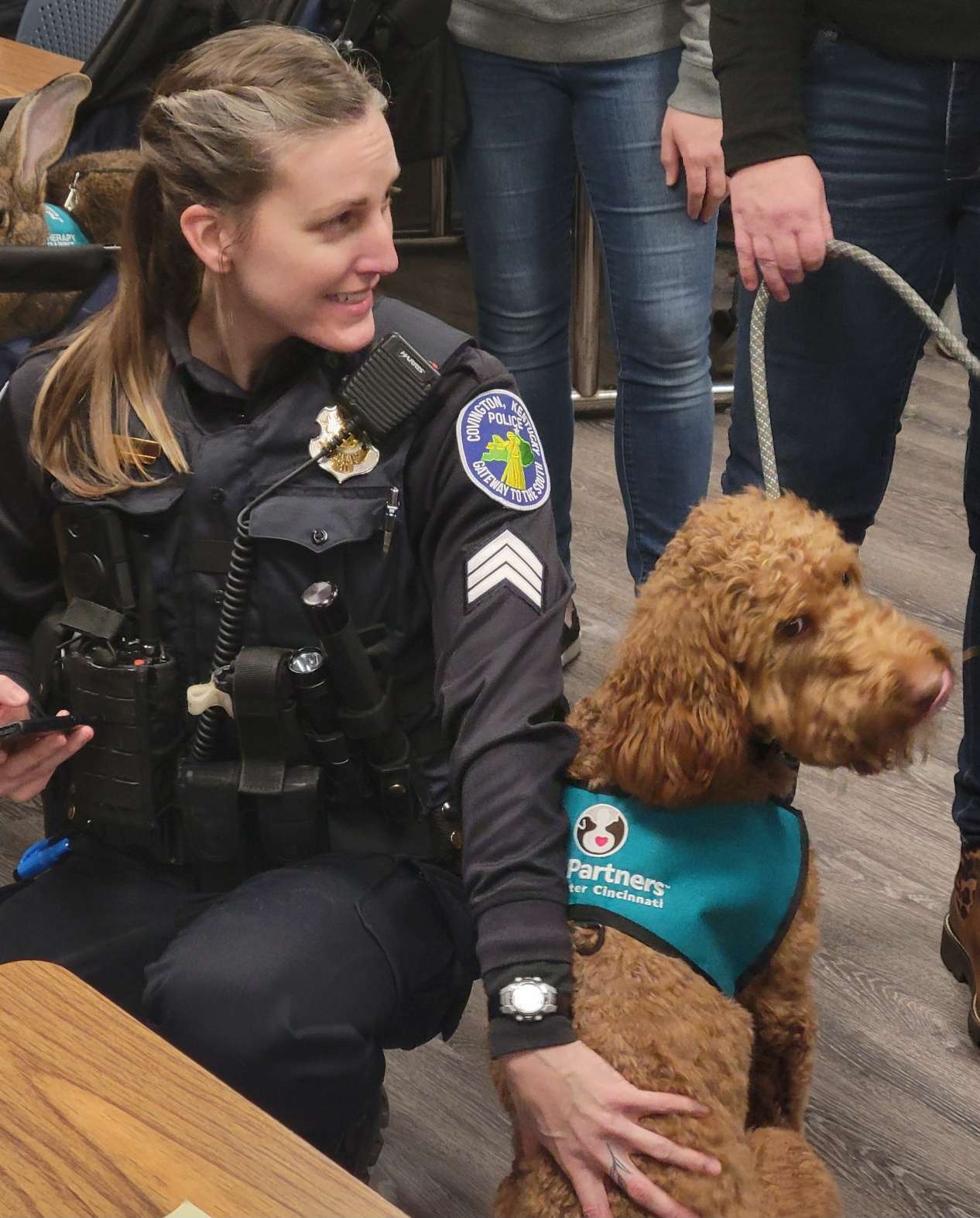 therapy dog with a police officer