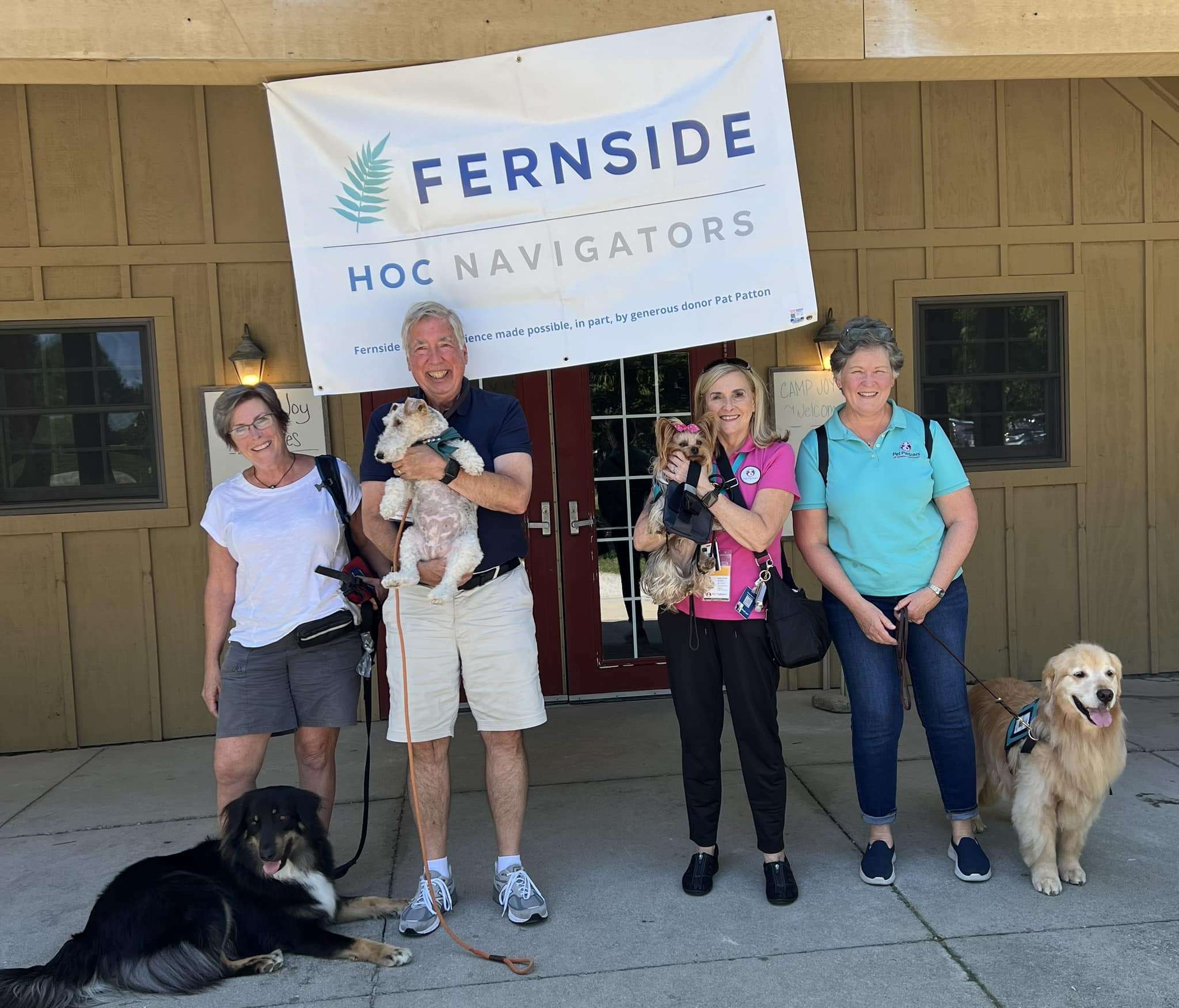 people and animals pose in front of Fernside HOC Navigators